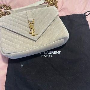 White bag with gold hardware